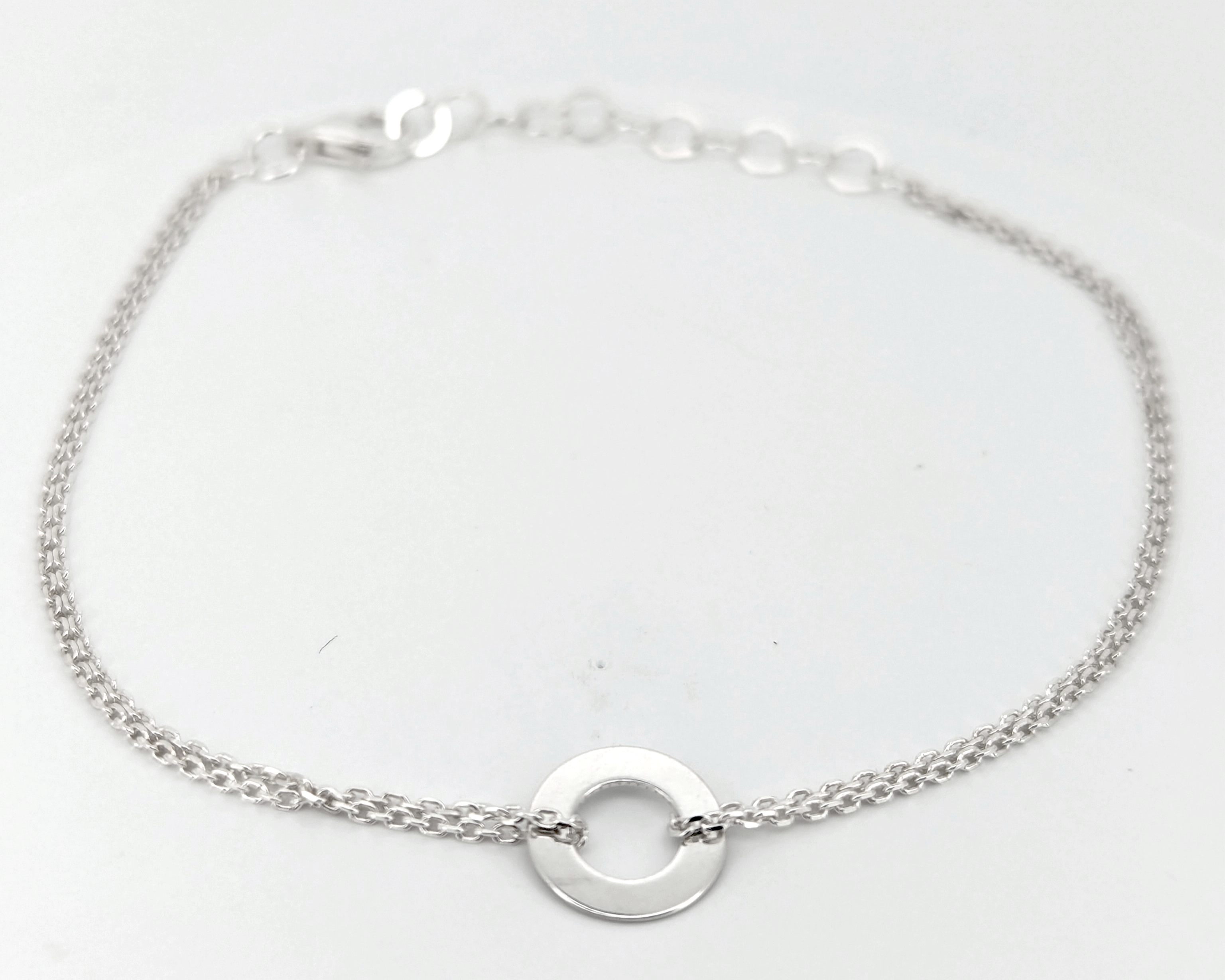 Silver bracelet with circle pedant
