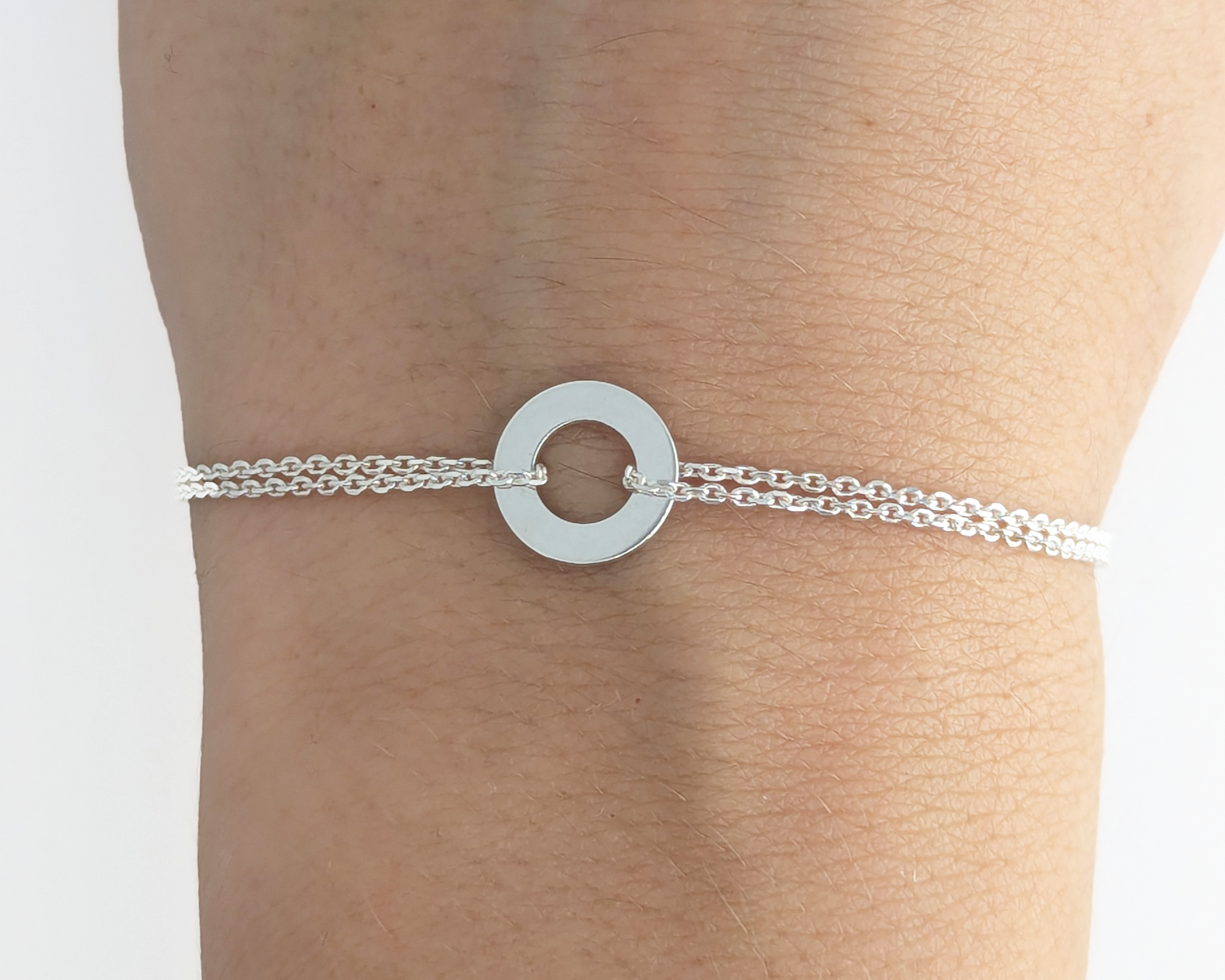 Silver bracelet with circle pedant