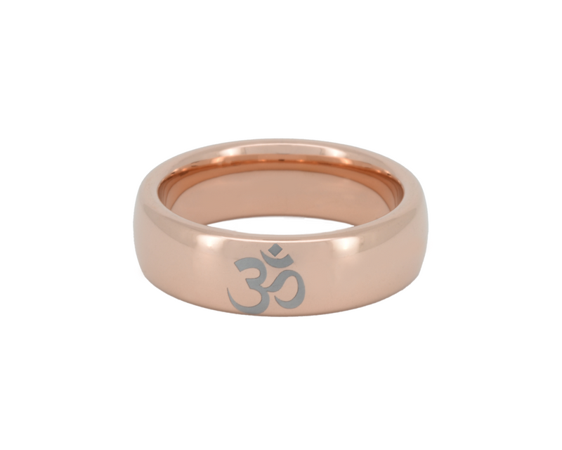 Rose gold ring with Om symbol on a white background