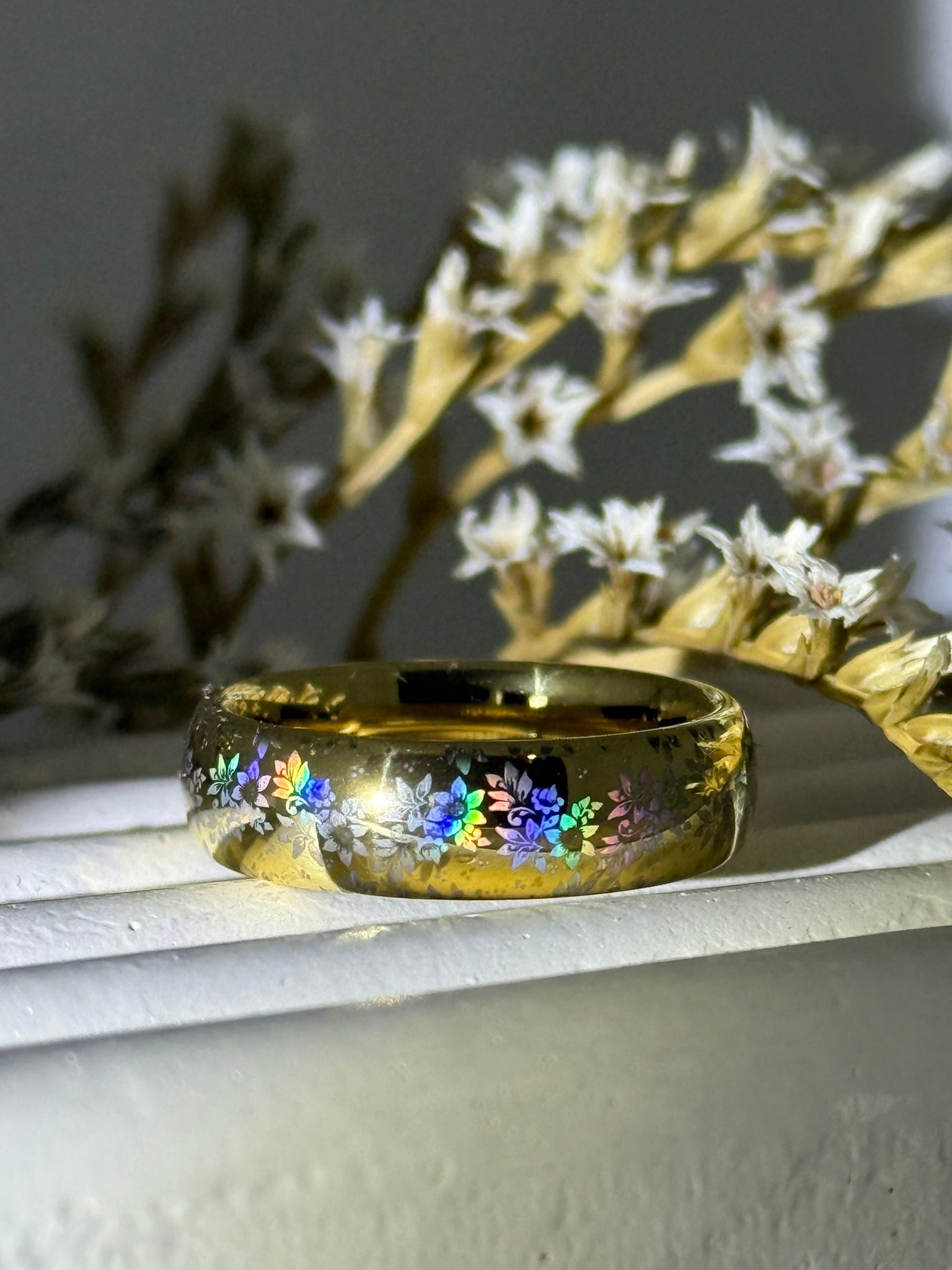 HoloRing featuring a laser-created holographic floral pattern