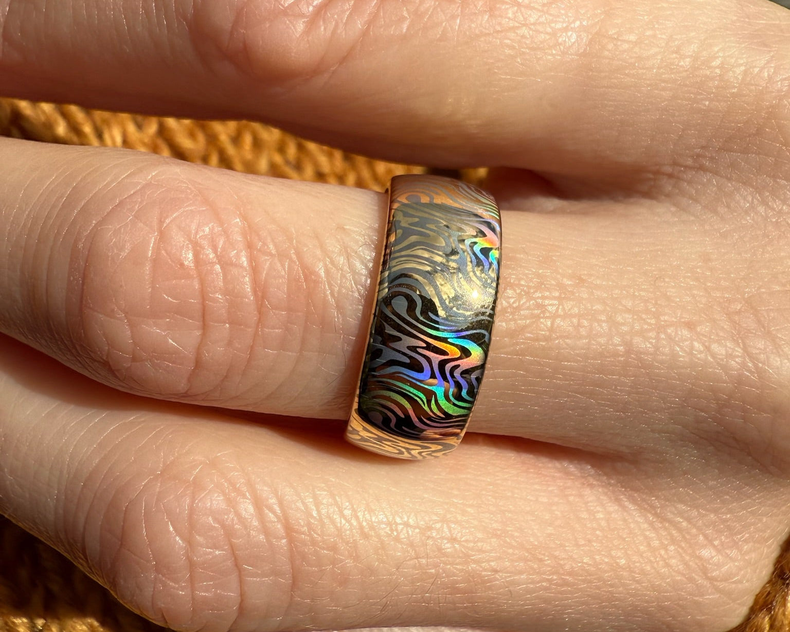 holographic ring with mokume design on a gold tungsten ring