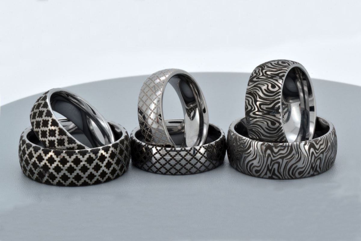 Six silver-tone HoloRing rings with different engraved patterns