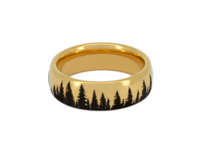 Gold tungsten ring with an engraved silhouette of an evergreen forest, isolated on a white background.
