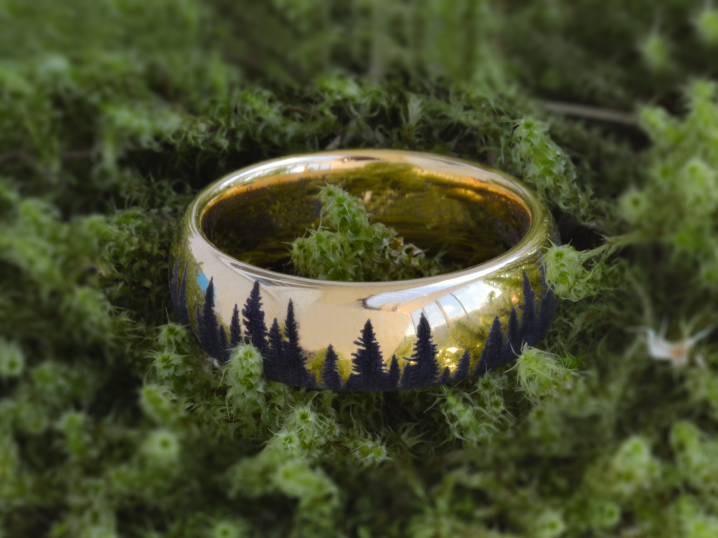 Two gold-tone HoloRing rings engraved with a mountain landscape
