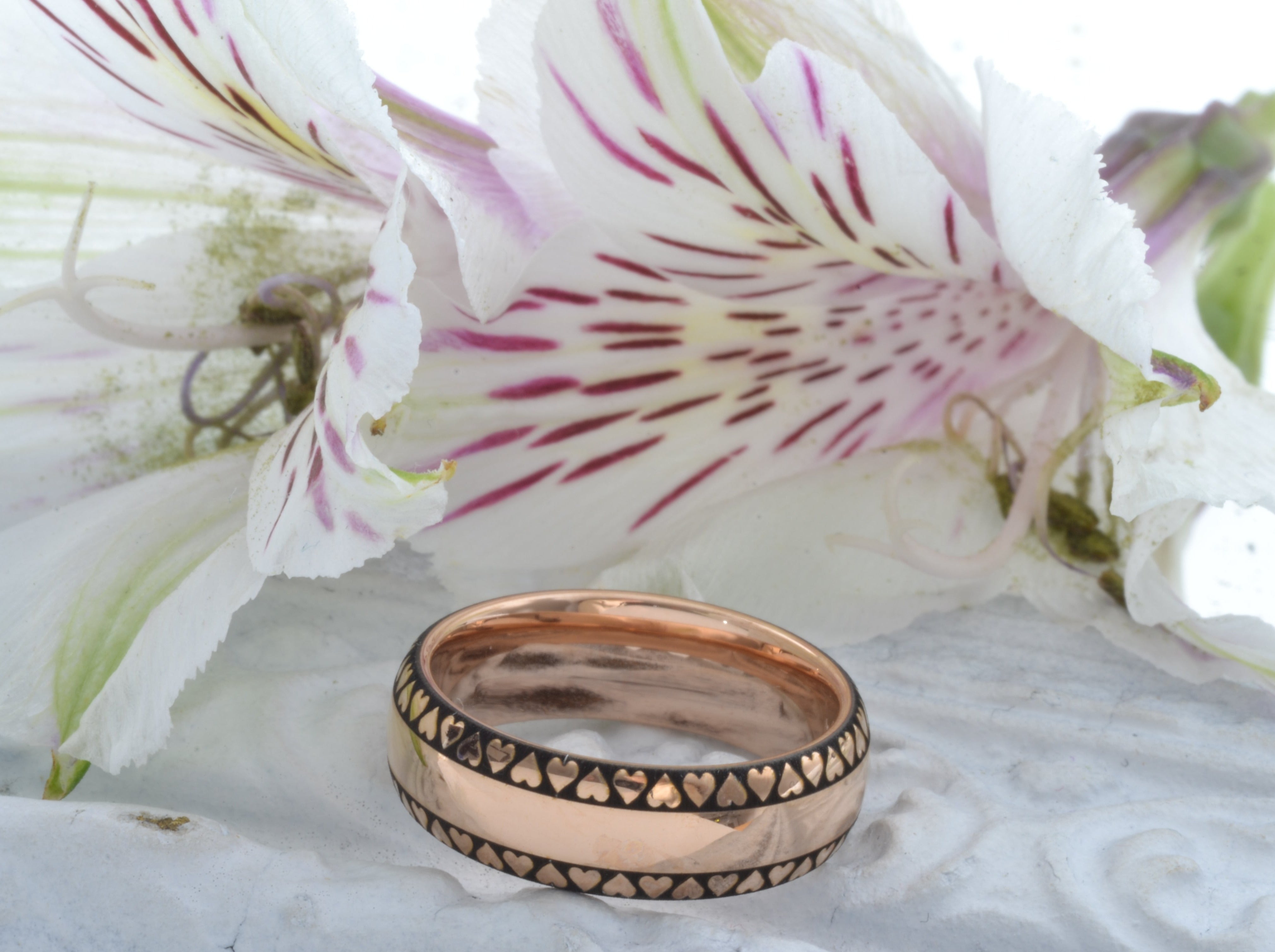 elegant luxury rose gold tungsten band with engraved heart pattern, romantic valentines gift for her, unique chic wedding ring, luxury anniversary gift with floral background