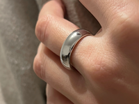 High Polished White Gold Tungsten Wedding Band with a polished plain surface, worn on a hand.