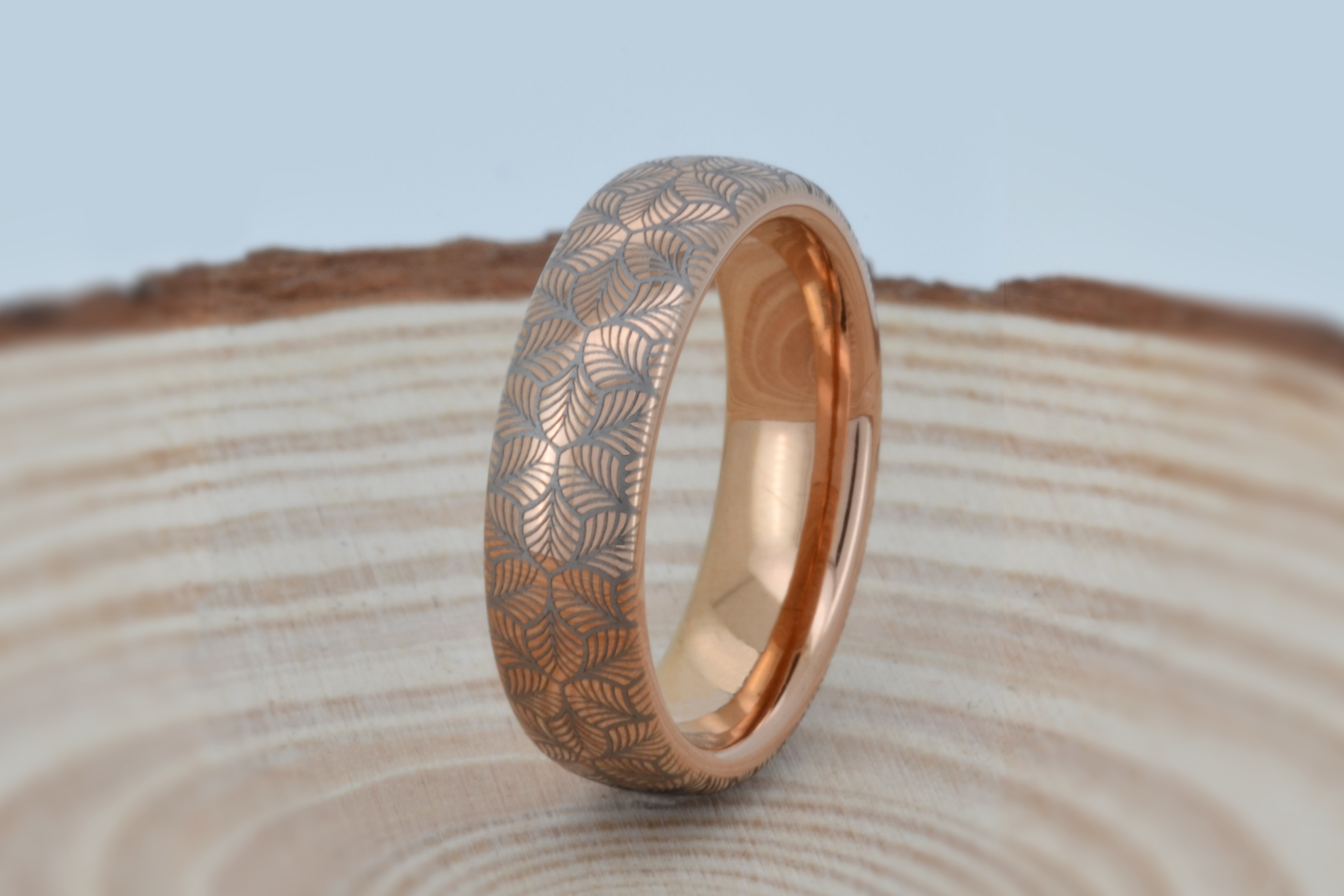 Rose gold tungsten ring with an intricate, white-engraved petal-like pattern, offering a delicate and refined look, perfect for weddings, special occasions, or everyday wear.