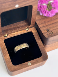 Product photo of the The Vintage Chic tungsten ring with laser-engraved surface detail.
