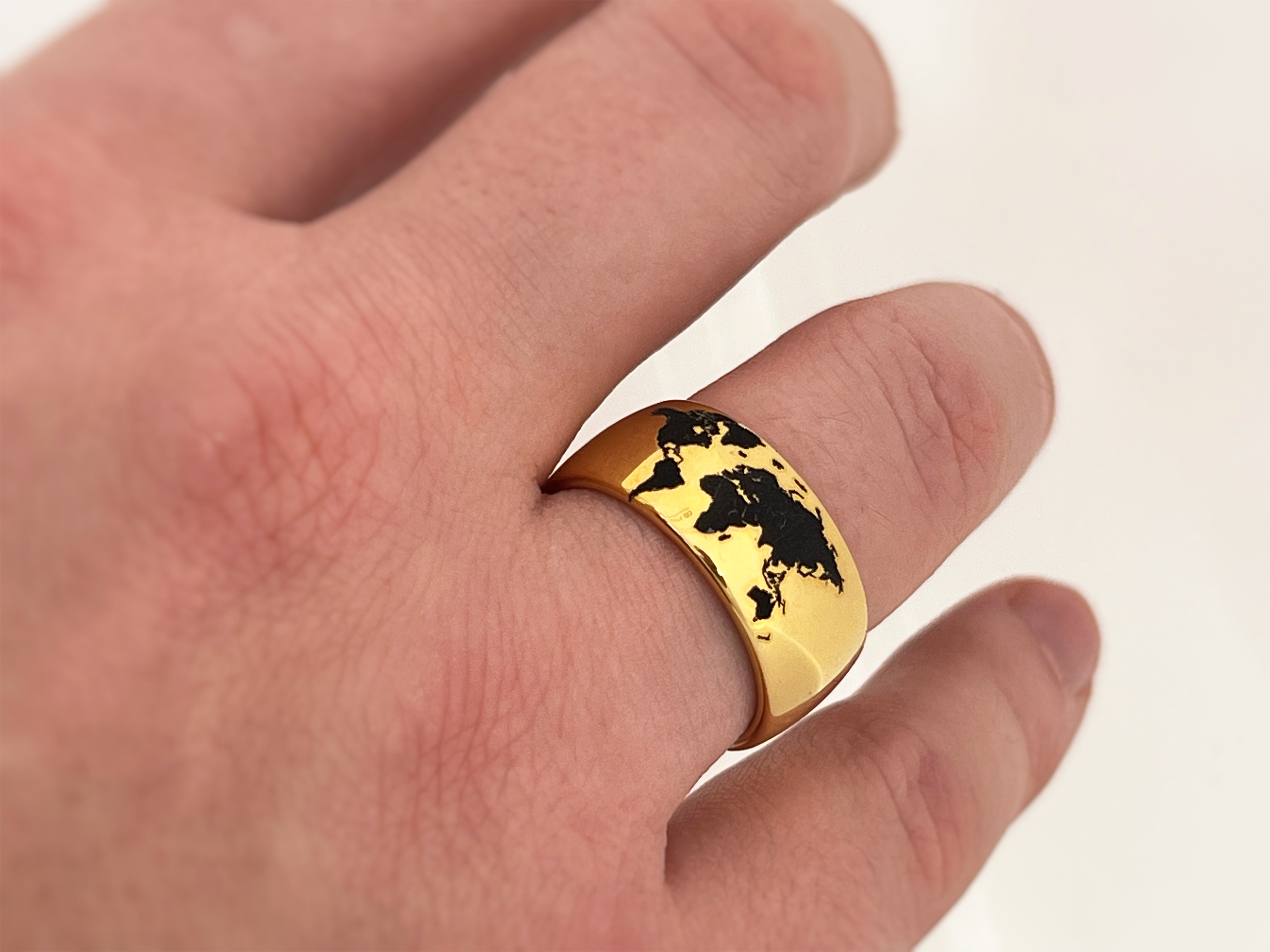 Highly polished Yellow gold tungsten ring with unique elegant black engraving of earth continents, premium high detail pattern. An ideal elegant gift for travellers and adventurers. Premium anniversary wedding band for special occasion or engagement. Luxury promise ring for friend, girlfriend, mother, mom or granny. Ideal original personalized present for her and him