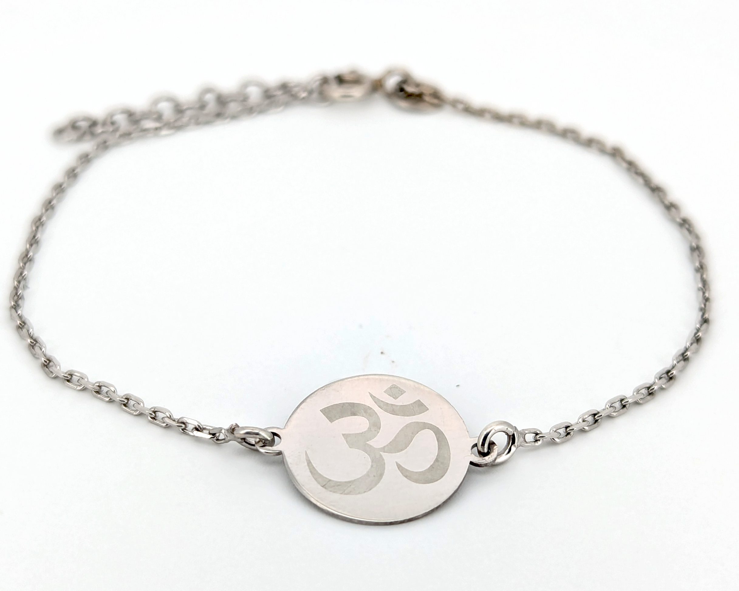 Personalized silver bracelet with engraved om symbol