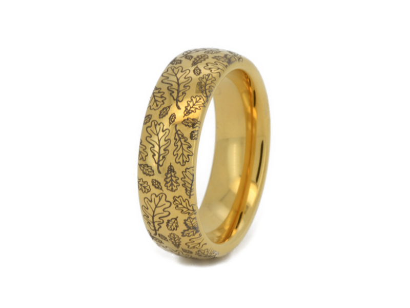 Elegant gold ring with intricate oak leaf engraving. This tungsten ring features a detailed oak leaf pattern that symbolizes strength and endurance. Perfect as a unique wedding band or stylish everyday accessory. High-quality craftsmanship combined with the durability of tungsten and the timeless appeal of gold.