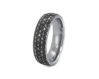 Silver ring with geometric pattern on a white background