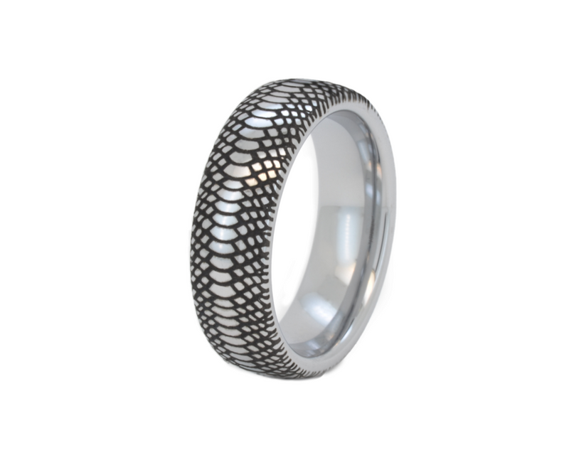 Silver tungsten ring with a black engraved snakeskin pattern, displayed on a white background.