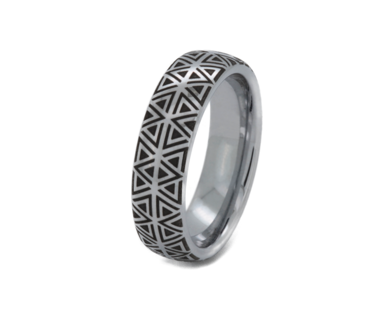 Silver ring with geometric pattern on a white background
