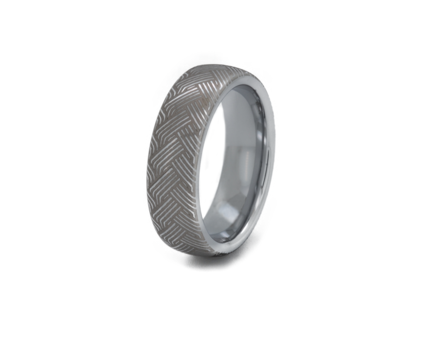 Silver ring with a textured pattern on a white background