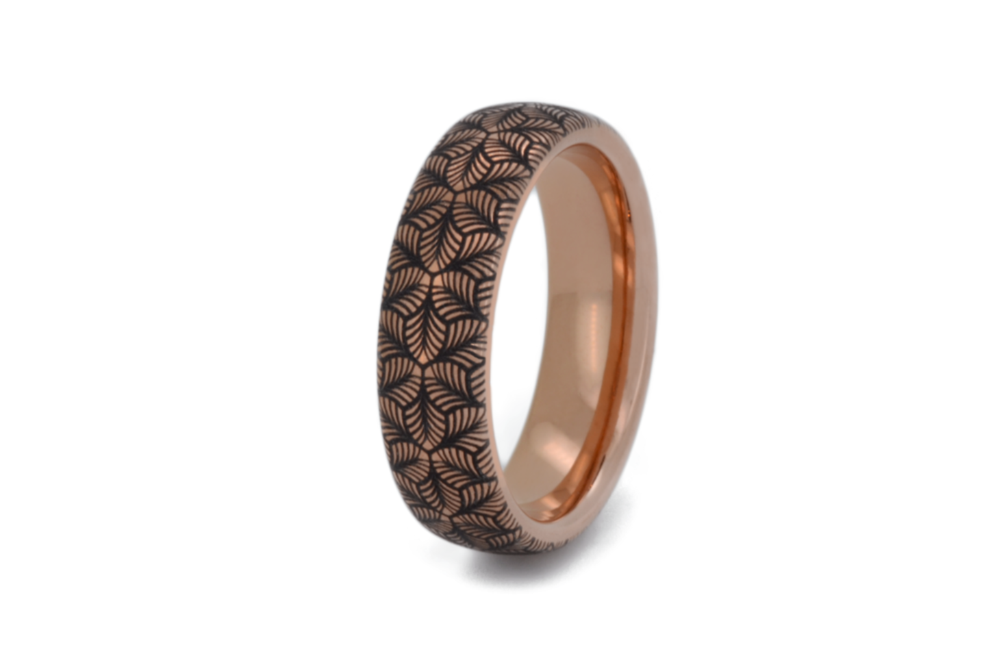 Rose gold tungsten ring with an intricate, black-engraved petal-like pattern, on a white background offering a delicate and refined look, perfect for weddings, special occasions, or everyday wear.