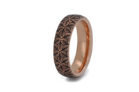 Petal Dance tungsten ring with laser-engraved surface detail, shown against a light background.