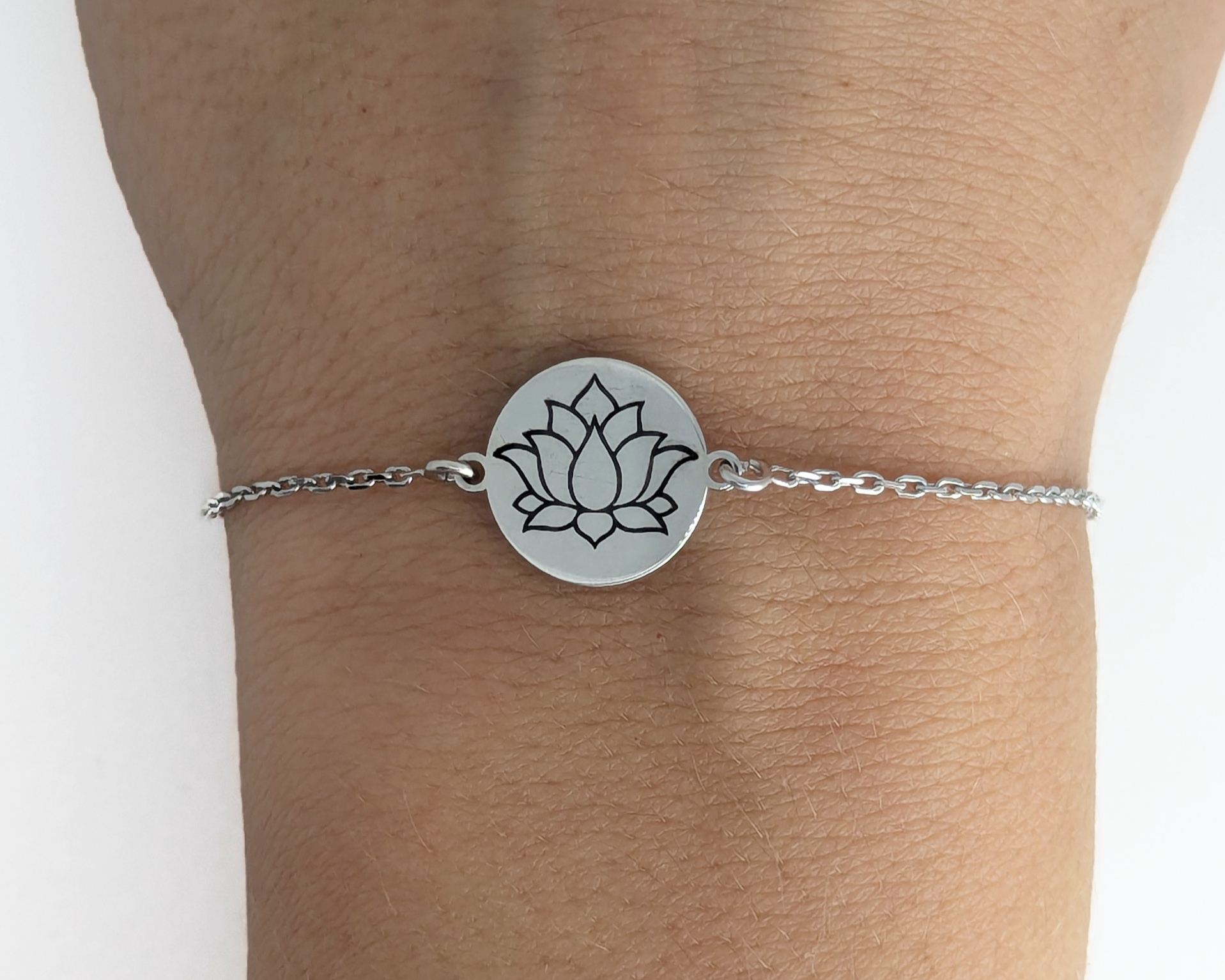 Personalized silver bracelet with engraved lotus symbol