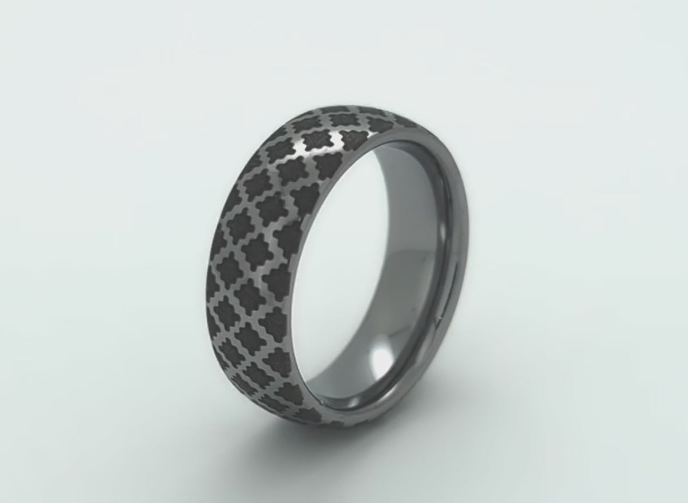 Video of silver and black tungsten ring with diamond shape engraving