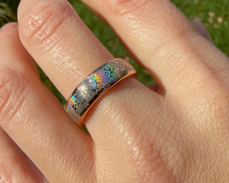 Beautiful holographic ethnical pattern on gold tungsten ring